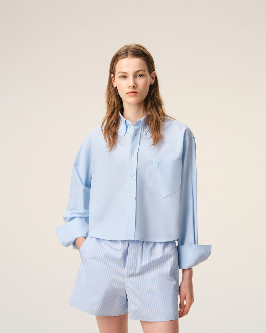 Blue cropped cotton shirt with embossed Ami de Coeur