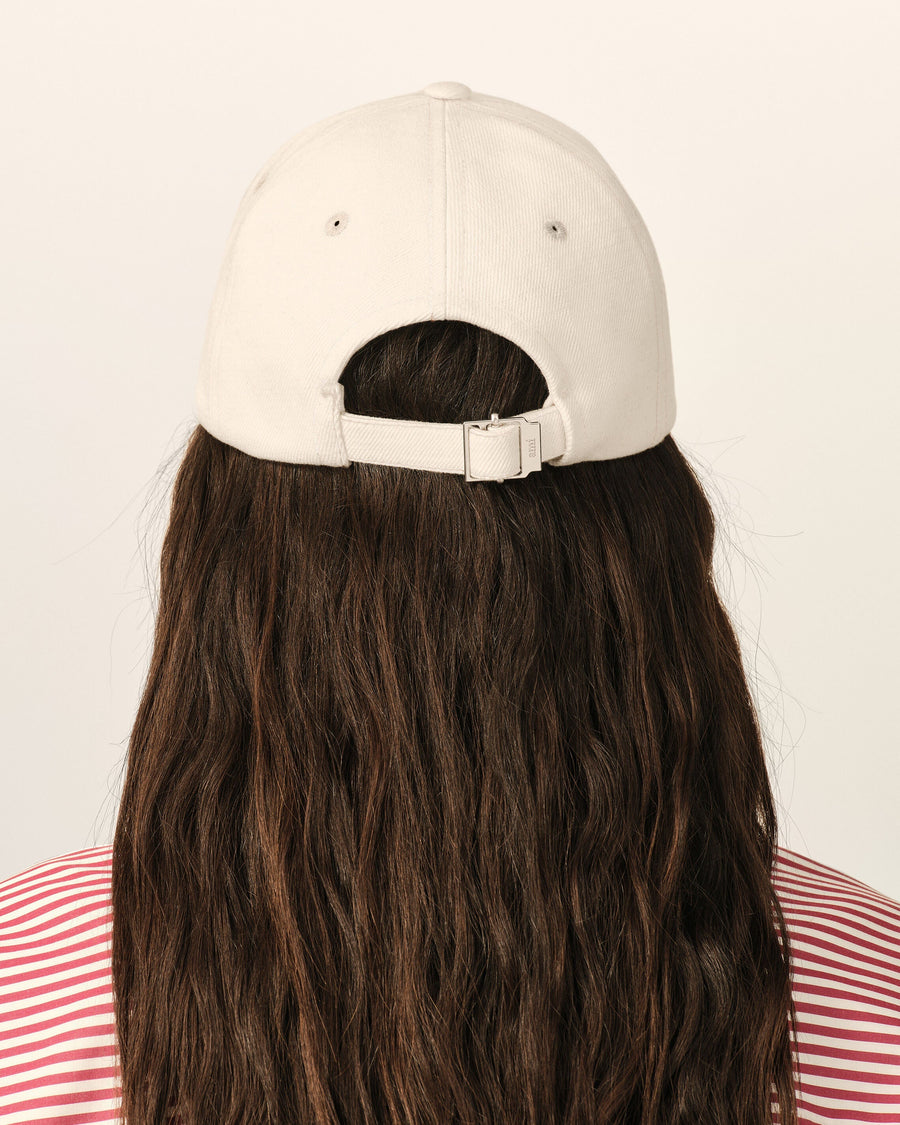 White cotton cap with Ami de Coeur arrow