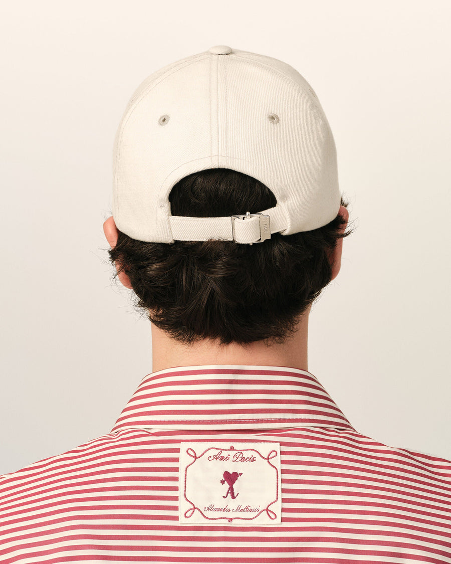 White cotton cap with Ami de Coeur arrow